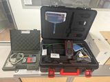 a black case with a red handle and a black case with a red handle and a black case with a red handle and a black case with a red