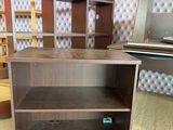 two bookshelves in the corner of a room