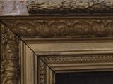 a close up of a picture of a painting on the wall