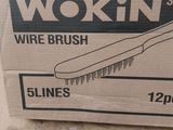 a box with a brush inside of it on the floor