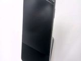 a cell phone that is sitting on top of a stand