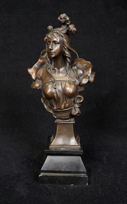 bronze bust of a woman on a pedestal with a black background