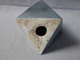 a small birdhouse with a hole in the middle of it