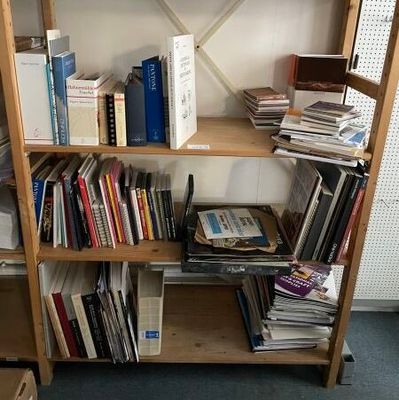 a book shelf with a lot of books on it