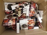 a cardboard box full of dvds and cds in it