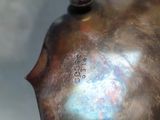a close up of a metal object with a tag on it