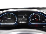 a close up of a car dashboard with a speedometer and a steering wheel