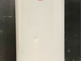 an image of a white water heater sitting on top of a tiled floor