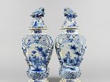 two blue and white vases with birds on them