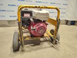 a close up of a small engine on a cart in a warehouse