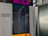 two nintendo wii controllers sitting on top of each other