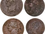 four different types of coins are shown on a white background