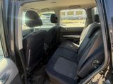 a car that has the door open and the seats down