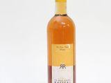 a bottle of wine that is sitting on a table