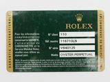 a close up of a rolex card on a white surface