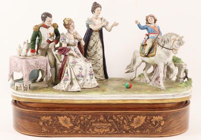 a figurine of a group of people on a horse