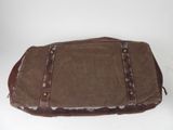 brown waxed canvas and leather messenger bag on a white background