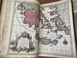 an old book with a map of the world in it