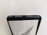 a close up of the back of a cell phone with a glass screen