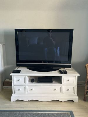 a television that is sitting on a stand in the living room