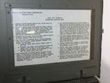 a sign on the back of a laptop that is sitting on a table