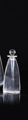 two clear vases sitting next to each other on a table