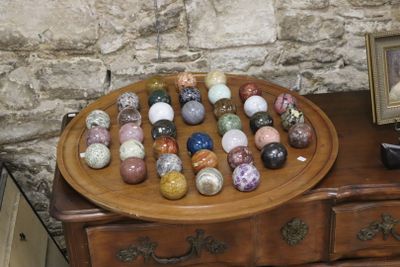 a picture of a wooden dresser with a bunch of eggs on top of it
