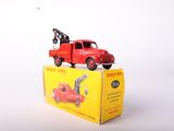 a red toy truck with a crane on top of it