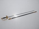 an old sword with a gold handle and a black handle