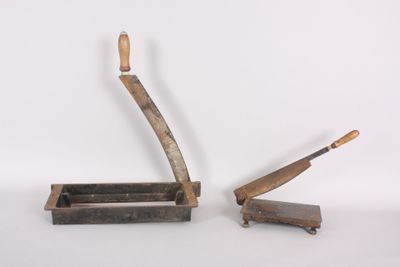 two old tools that are sitting on a table