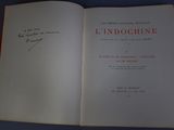 an open book with writing on it on a blue surface