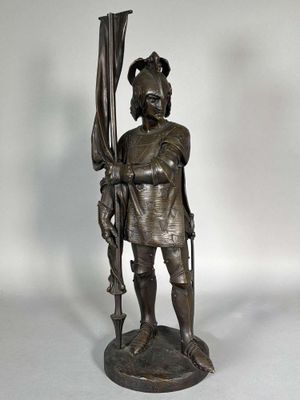 statue en bronze représentant un homme avec un parapluie sur fond blanc