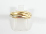 an image of a gold ring on a white surface