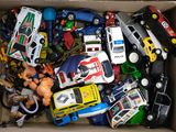 a box full of assorted toy cars in it