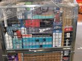 a cart with many boxes on top of it in a warehouse