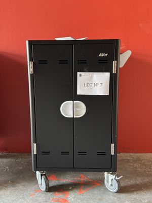 a black locker with a lot of paper on it