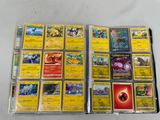 a lot of pokemon cards that are on the table