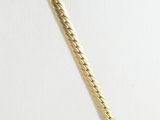 a close up of a gold necklace on a mannequin mannequin mannequin mannequin mannequin mannequin mannequin manne
