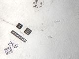 an image of a silver plate with some stickers on it