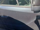 a car that has a broken door handle on the side of the car
