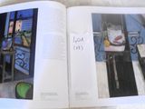 a book with a picture of a cat and a picture of a window
