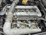 a car engine that is sitting in the trunk of a car