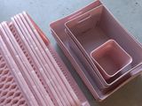 many plastic containers that are sitting on a table