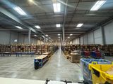 a large warehouse filled with lots of boxes and pallets