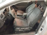the interior of a car with two seats and a steering wheel