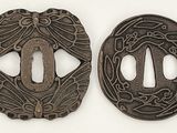 deux tsubas anciennes en fer ornées de motifs décoratifs