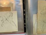two drawings of a man and a woman on a piece of paper