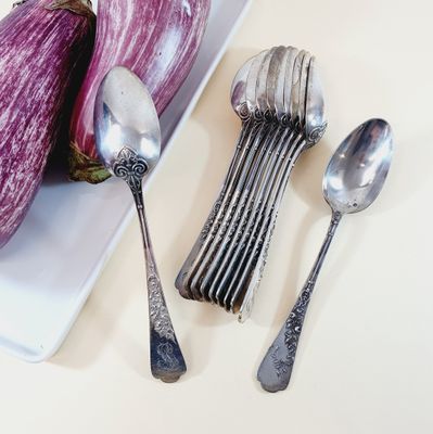 spoons, spoons and an eggplant on a white plate