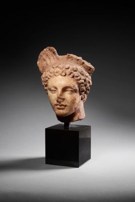 a roman marble head of a woman
