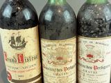 three bottles of wine sitting next to each other on a table